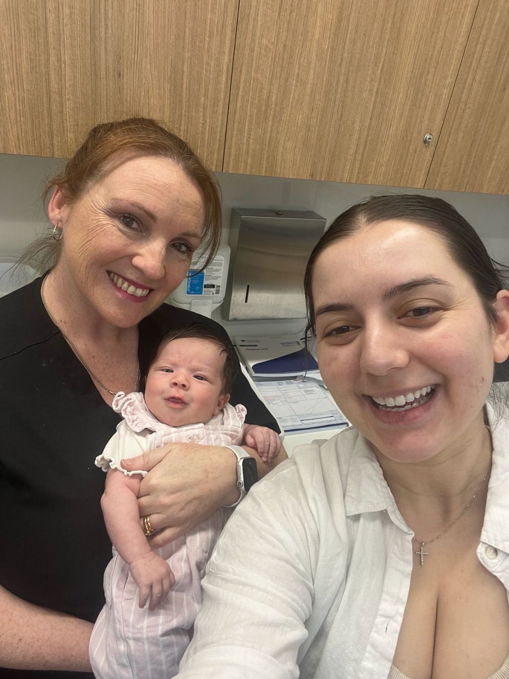 Rebecca with a new mother and her newborn baby